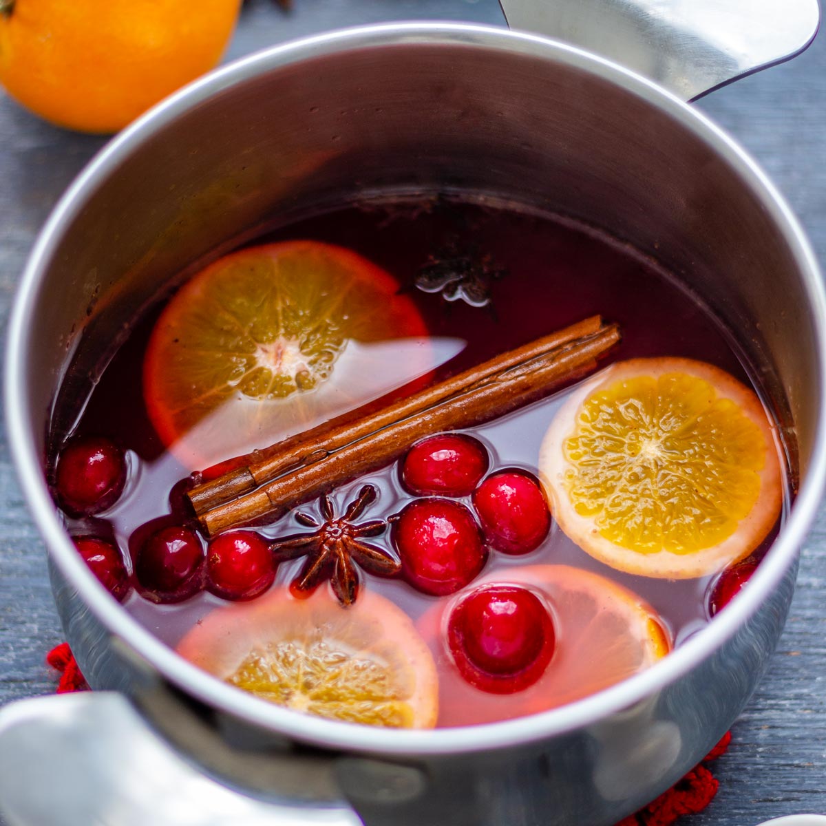  NON-ALCOHOLIC MULLED WINE with orange and cinnamon sticks