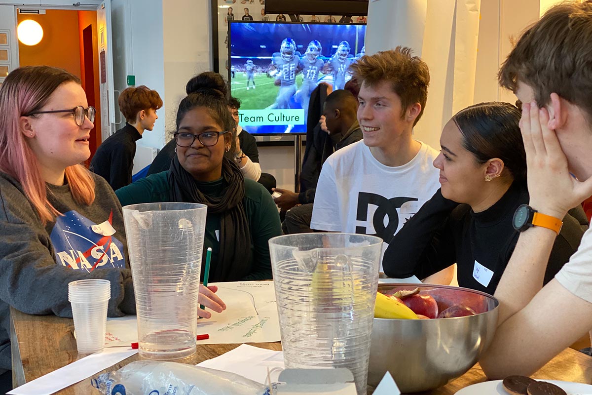 Group of young people around a table