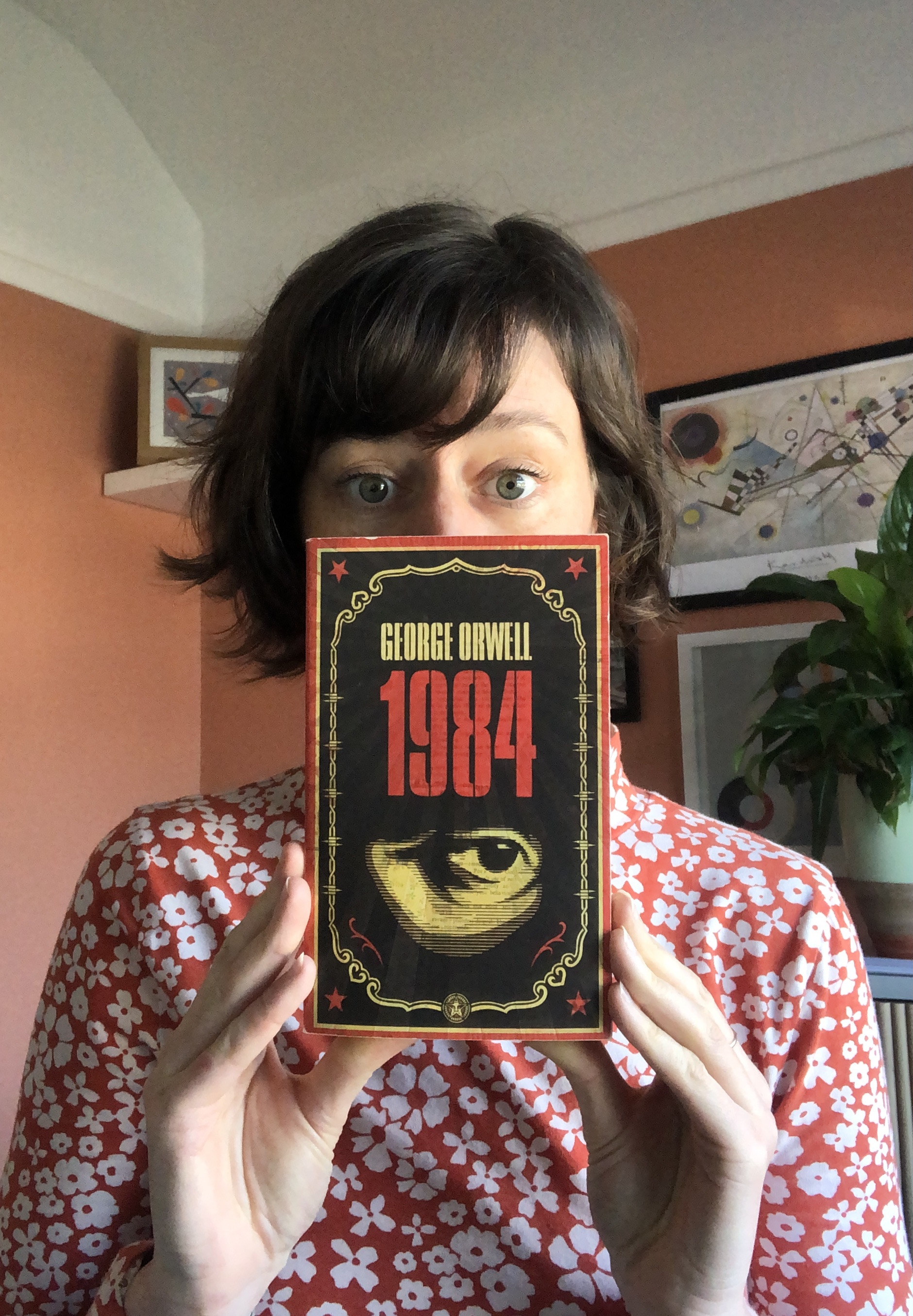 Nic holding 1984, by George Orwell