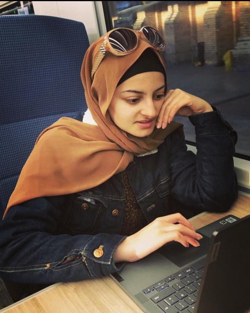 Yousra on a laptop NCS