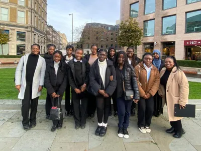 A group of young people posing for a group photo